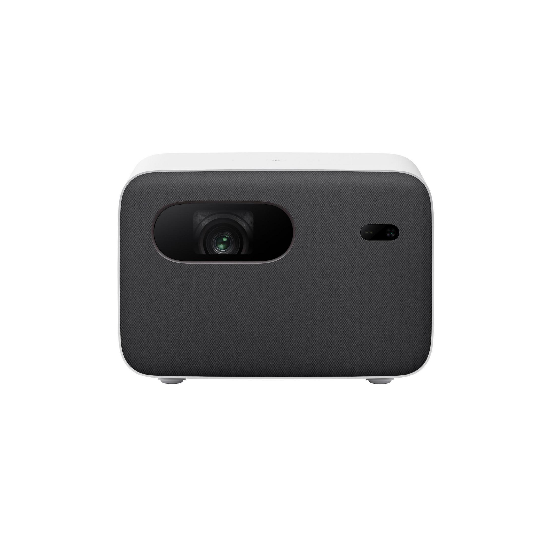 Proyector blanco y gris oscuro. Tiene una lente y un área negra pequeña en su lado.