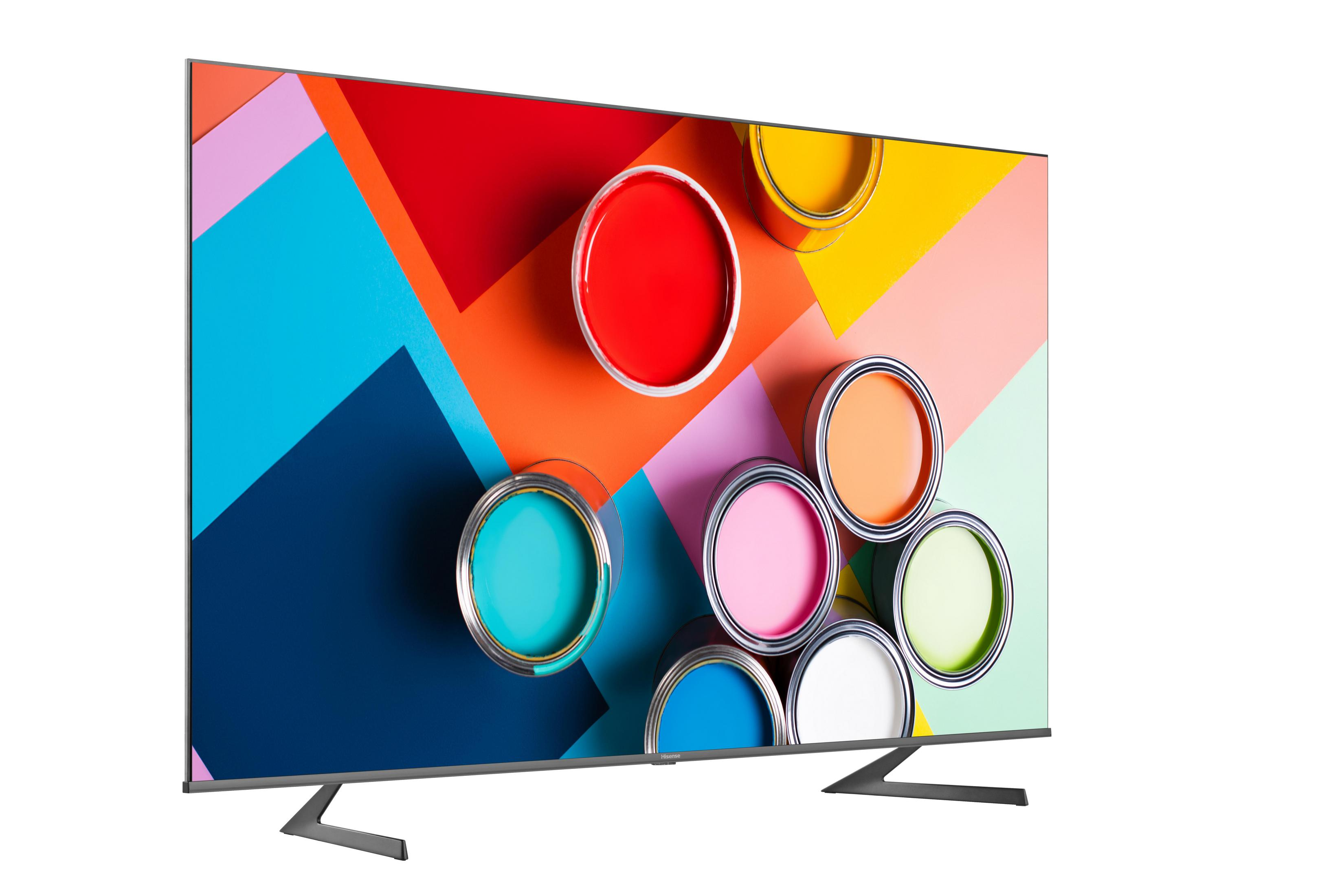 Telewizor z kolorowymi puszkami farby na ekranie i ukośną podstawą.