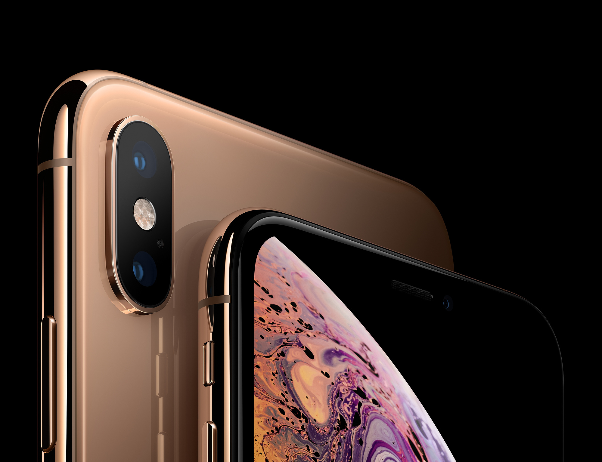 Zbliżenie złotego iPhone'a XS Max, pokazujące aparat i część ekranu.