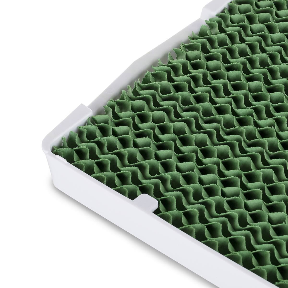 Biała i zielona podkładka chłodząca z wzorem plastra miodu. Podkładka jest ustawiona pod kątem i pokazuje powierzchnię.