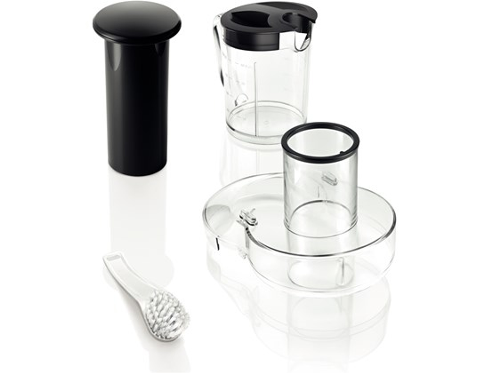 Pièces de mixeur : cylindre noir, pichet transparent, récipient transparent et une brosse.