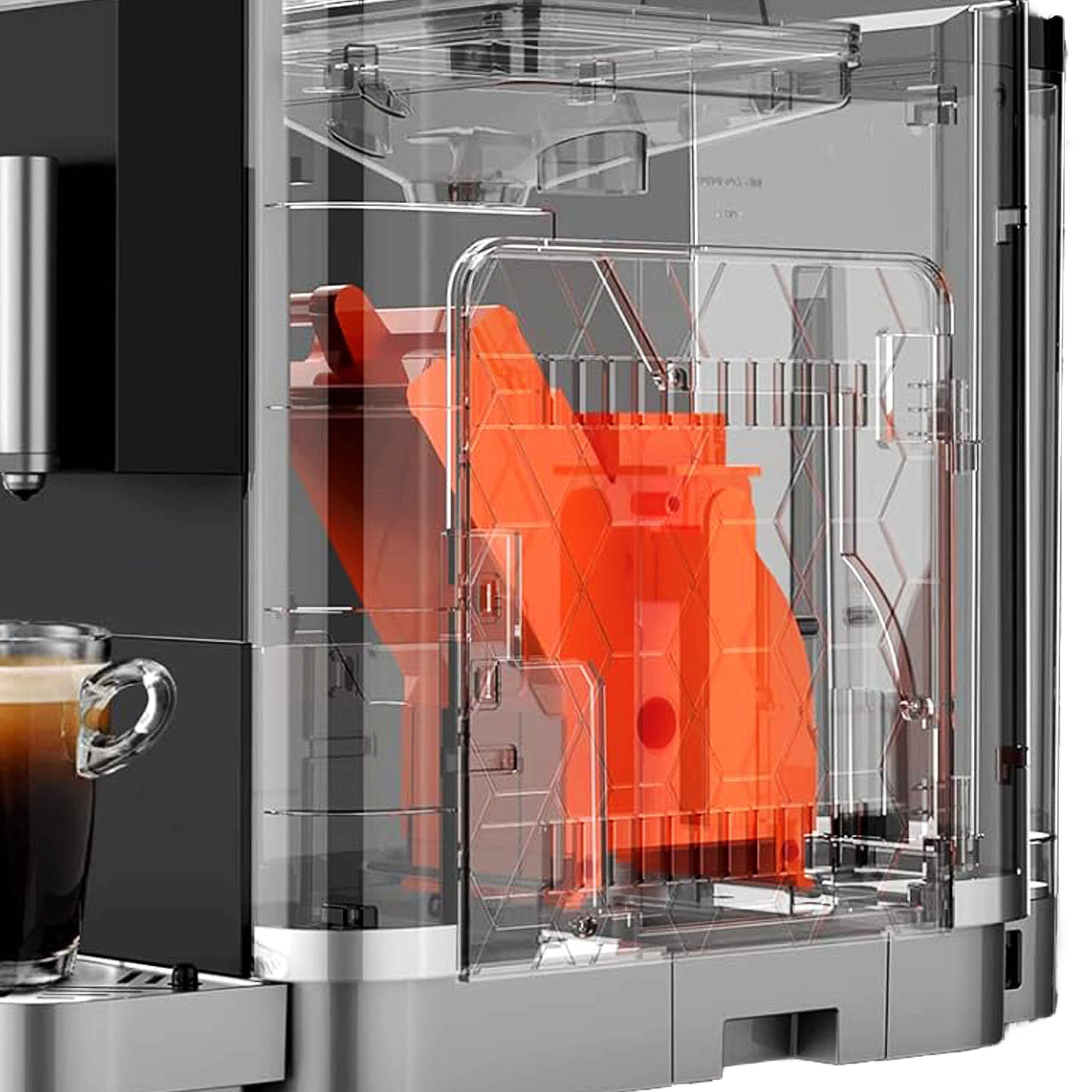 Primo piano dell'interno di una macchina da caffè con componenti arancioni e una tazza di caffè.