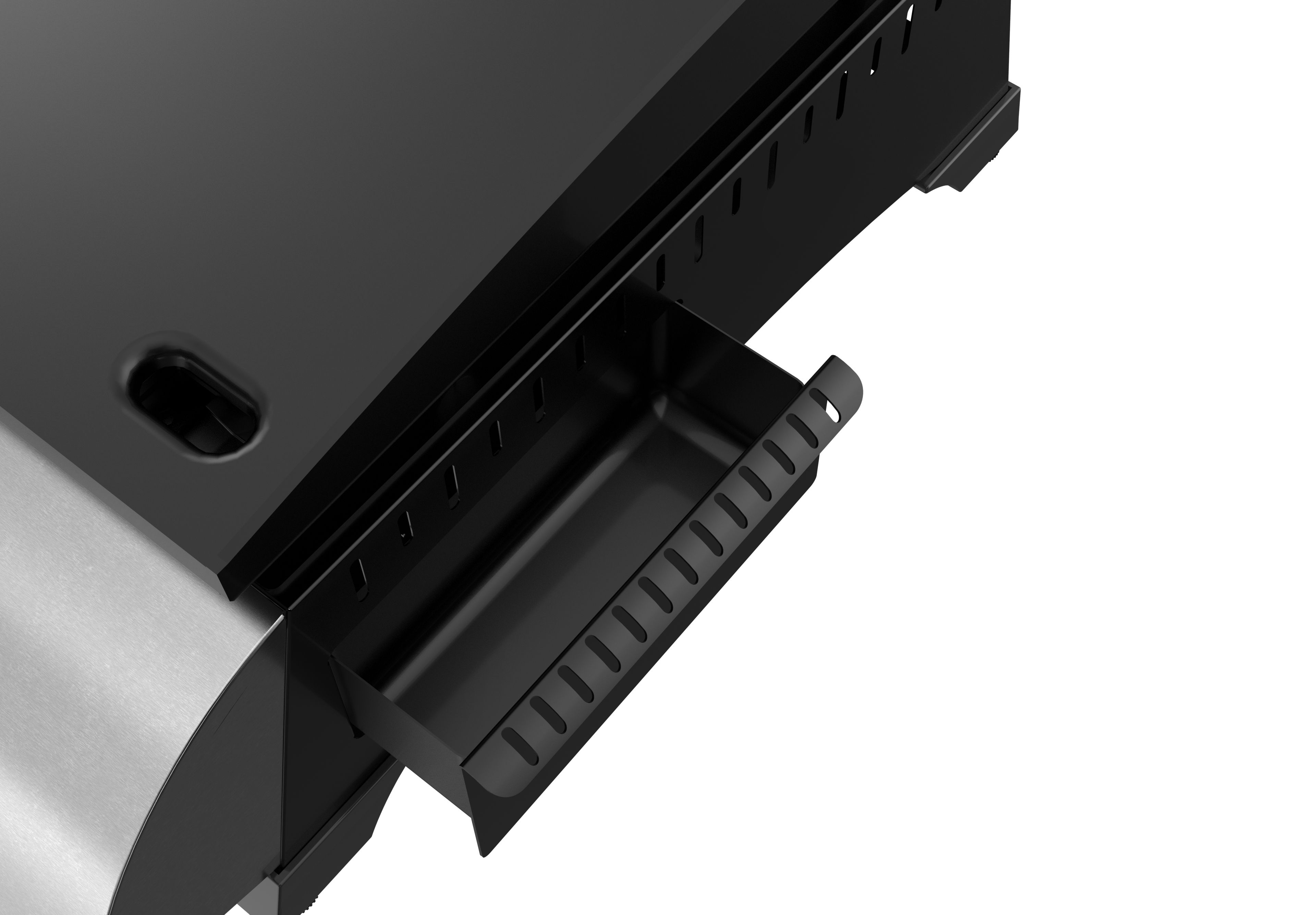 Eine schwarze Metallschublade in einem Grill. Sie ist geöffnet und zeigt eine Ablage.
