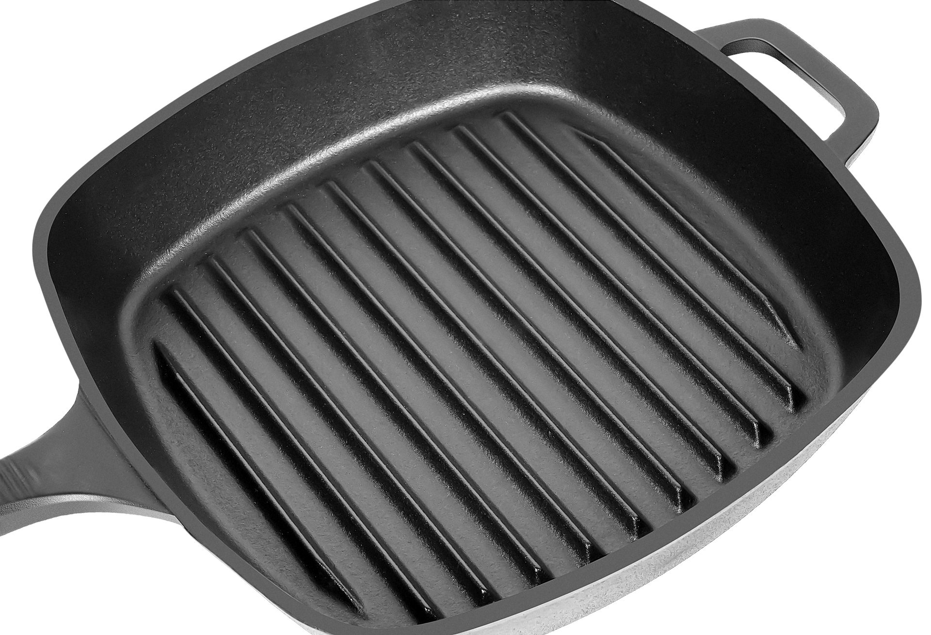 Eine schwarze Grillpfanne mit Rippen, bereit zum Kochen. Es ist auf weißem Hintergrund.