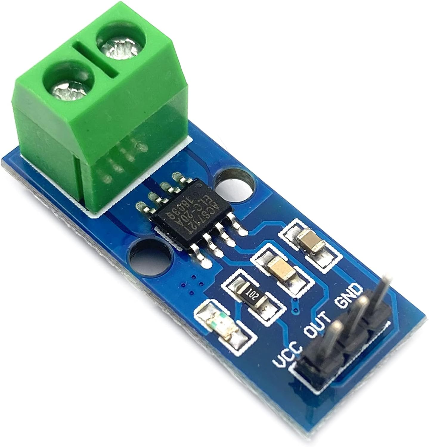 Kleine elektronische Komponente mit mehreren Pins und einem grünen Stecker.