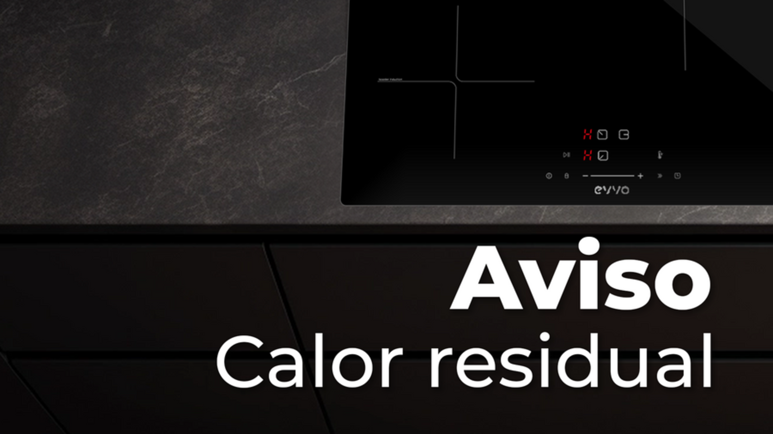 Encimera negra con el texto 'Aviso' y 'Calor residual' en español. La encimera está apagada.