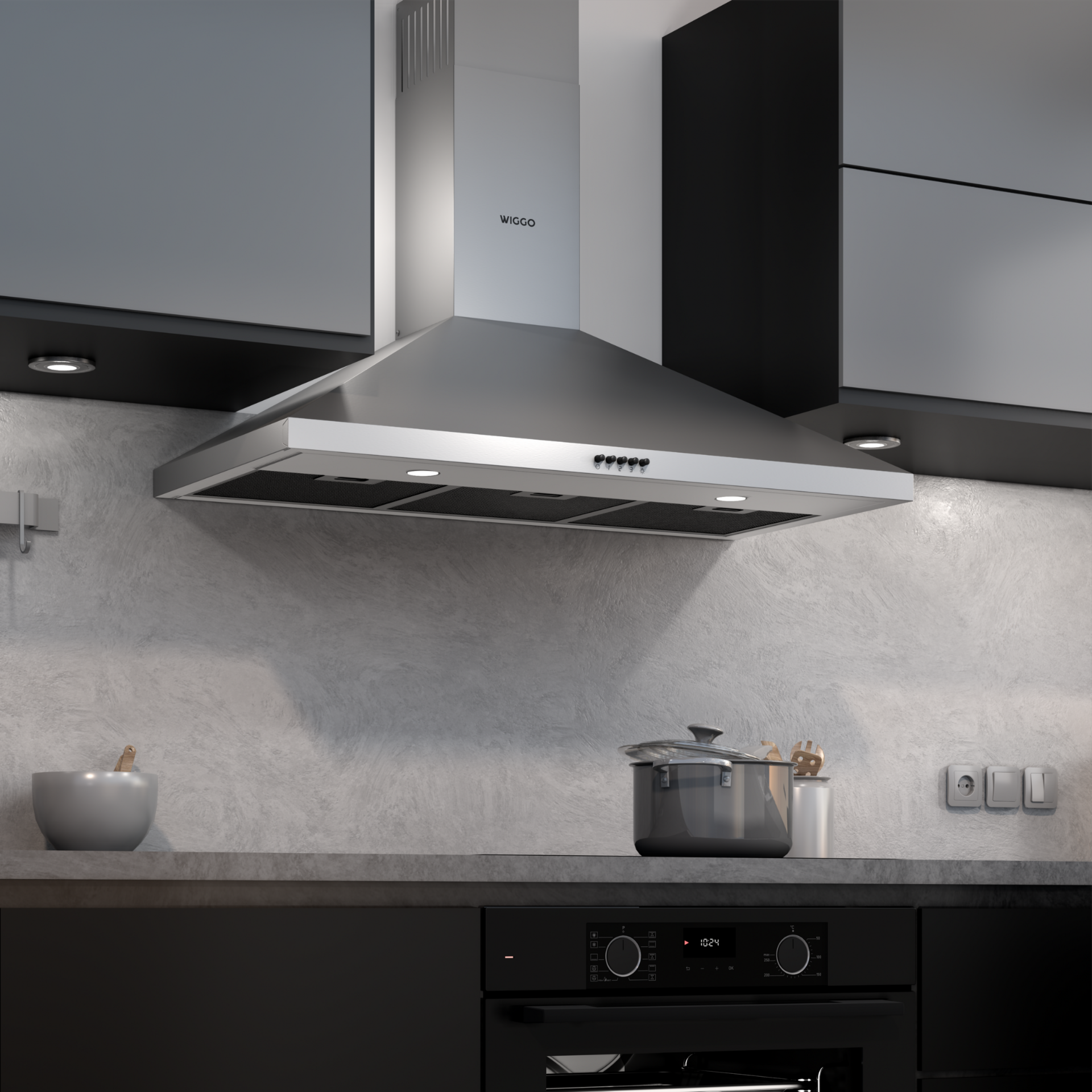 Une hotte en acier inoxydable au-dessus d'une table de cuisson dans une cuisine moderne.