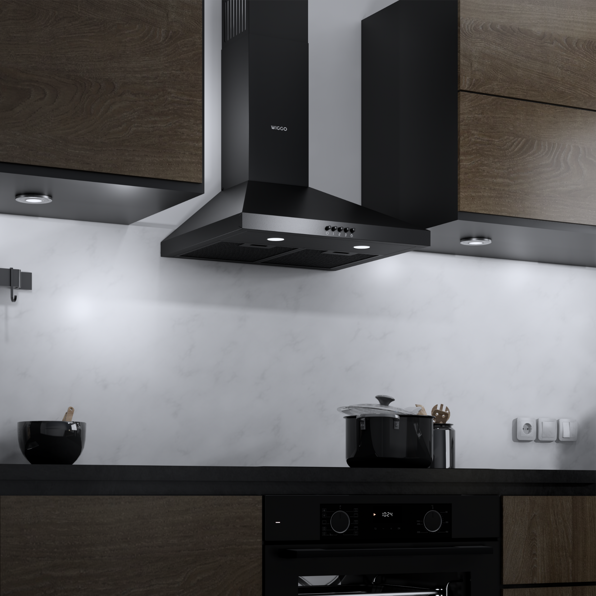 Intérieur de cuisine avec hotte noire, placards. Une casserole sur la cuisinière, un bol et un four sont visibles.