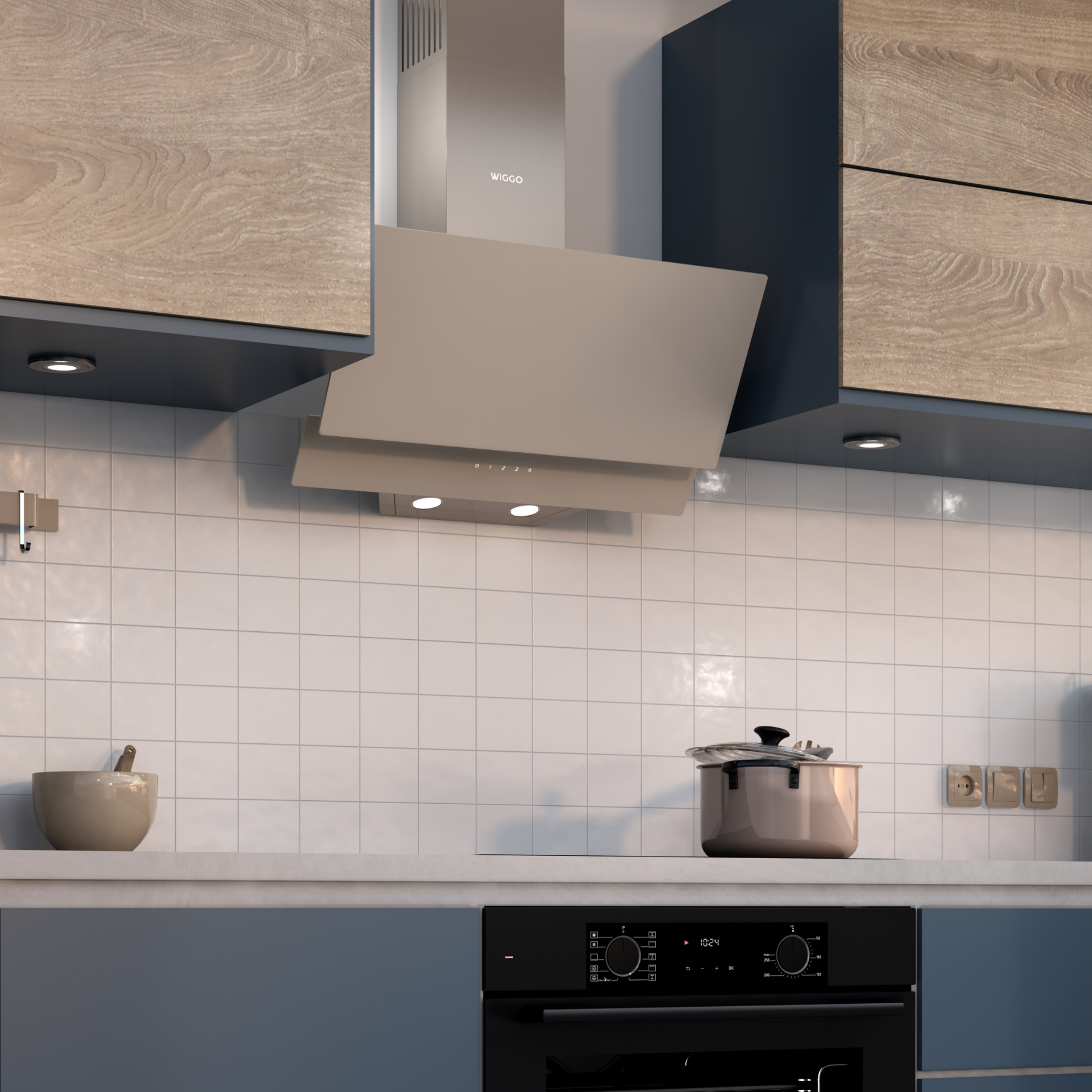 Intérieur de cuisine avec hotte, placards et four noir.