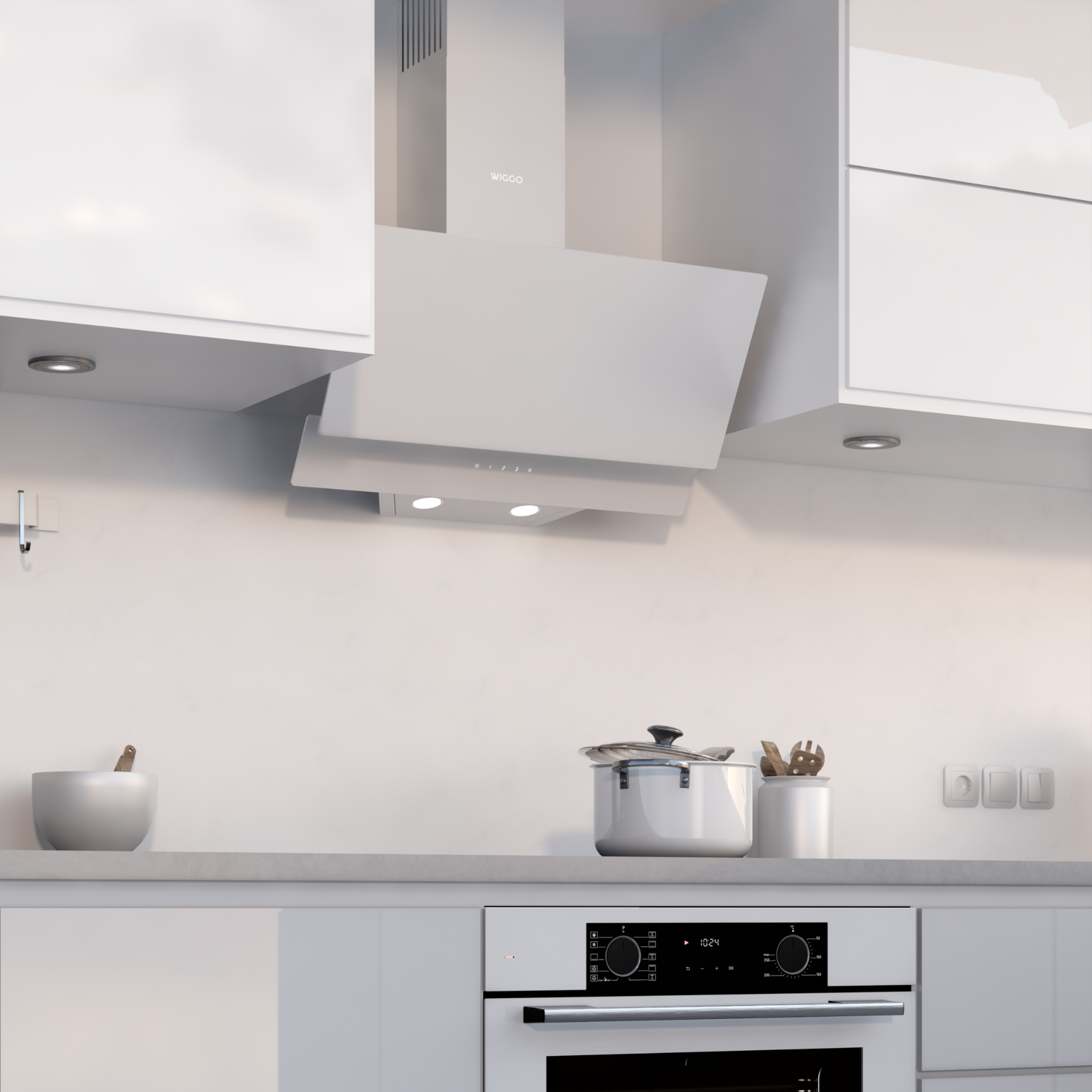 Cuisine blanche avec hotte, four et placards. Une casserole et des ustensiles sont visibles.