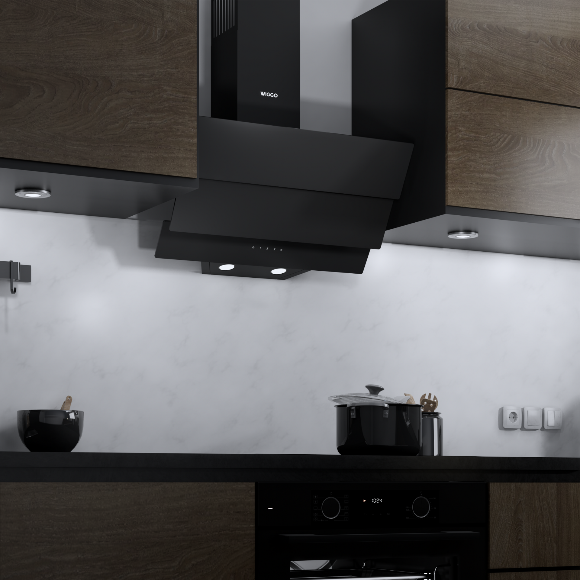 Moderne keuken met een zwarte afzuigkap, kasten en een zwart aanrecht met een pan.