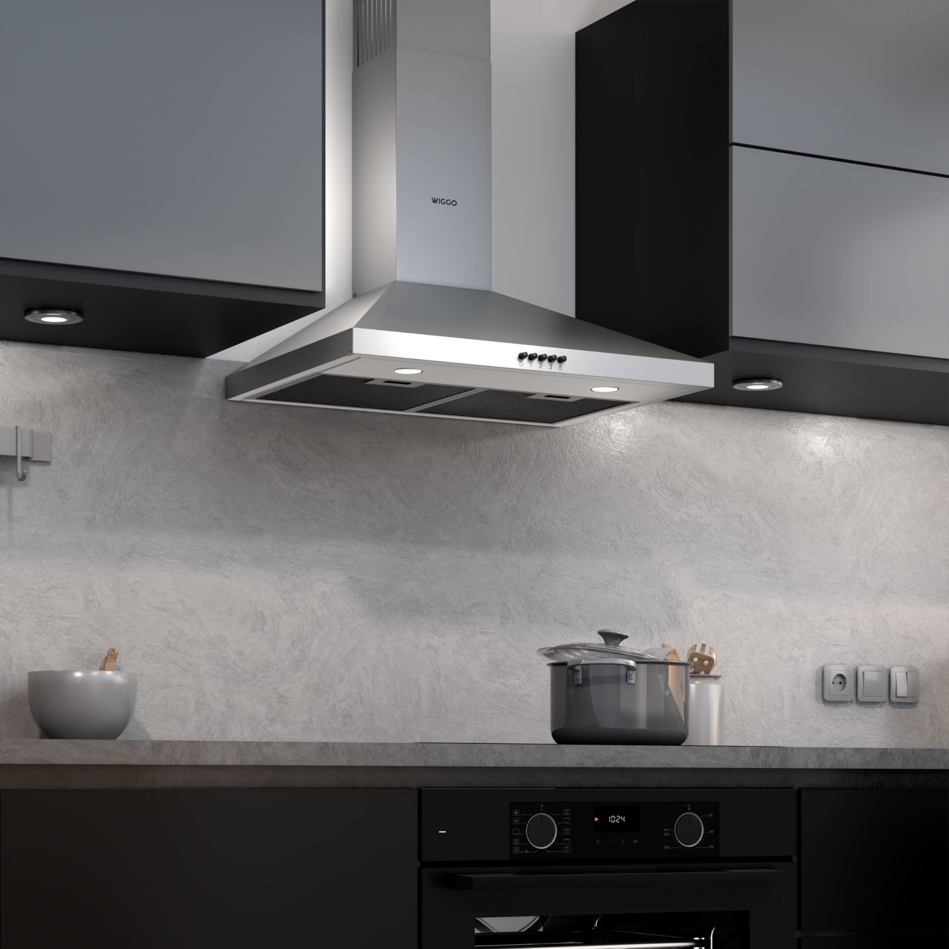 Cuisine moderne avec four noir, plan de travail gris et hotte en acier inoxydable.