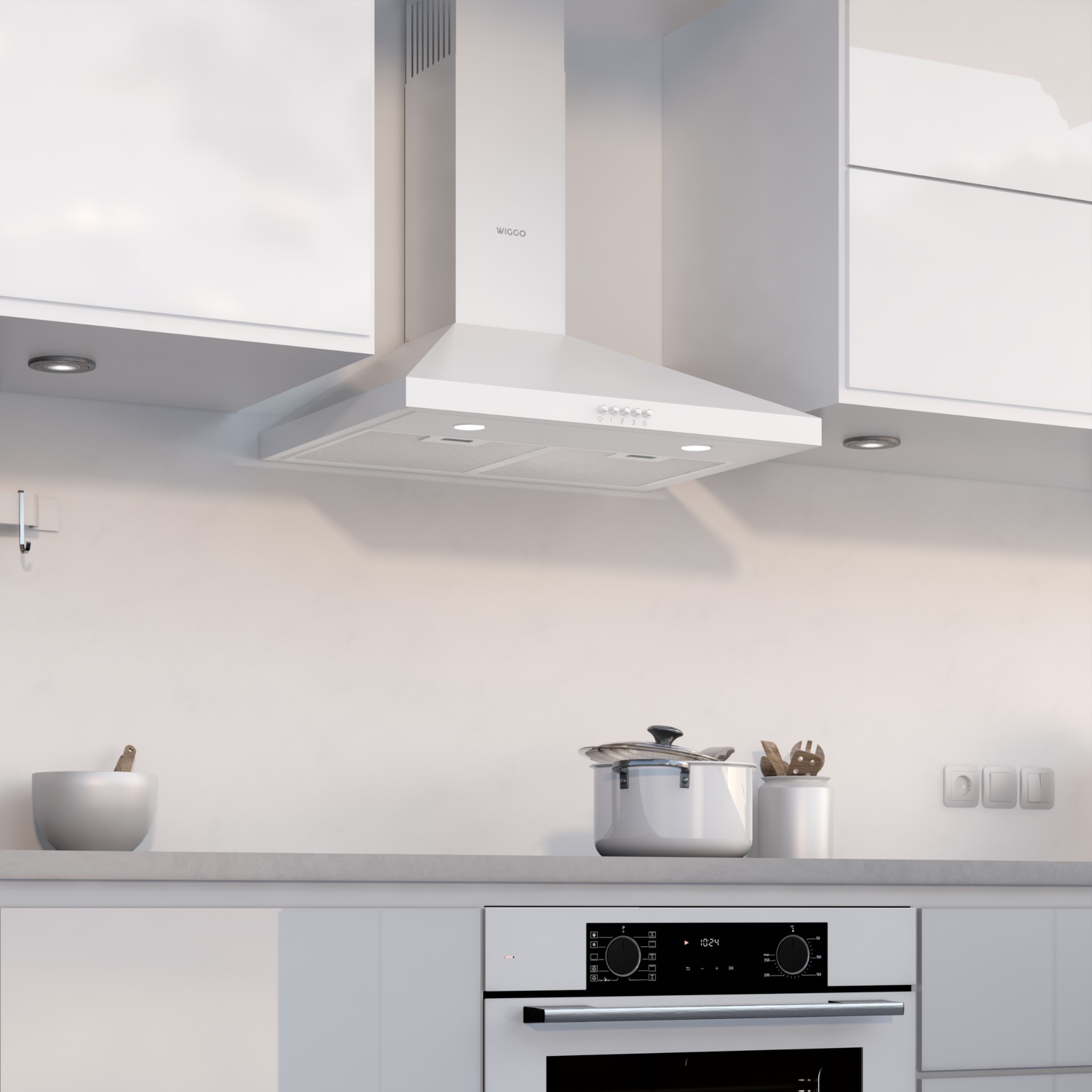 Cuisine blanche avec hotte, appareils et placards.
