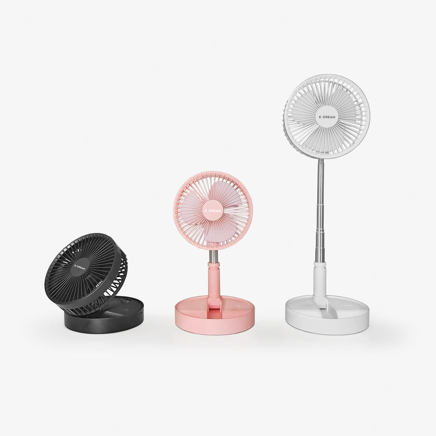 Tre ventilatori: nero, rosa e bianco, con design diversi, su una superficie bianca.