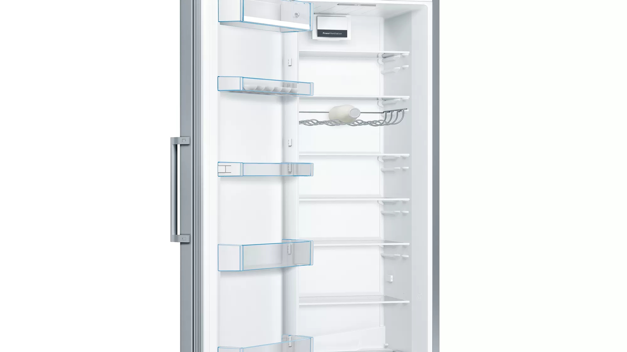 Interior de un refrigerador, abierto. Estantes, cajones y componentes interiores son visibles.