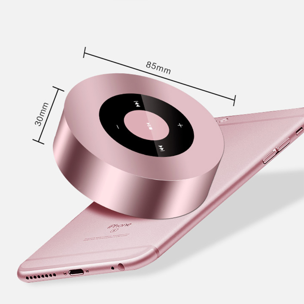 Roségoldener Bluetooth-Lautsprecher auf einem rosa Telefon, Abmessungen 85mm x 30mm.