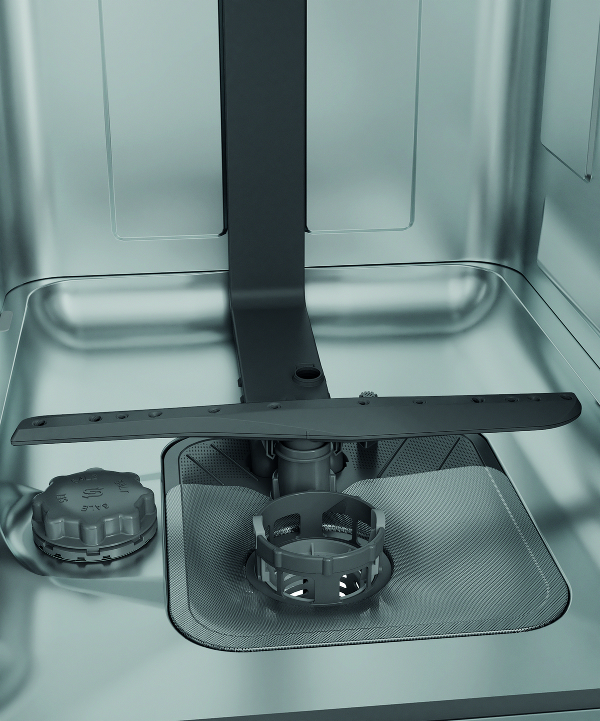 Interior de lavavajillas con aspersores, filtros y compartimento para detergente.