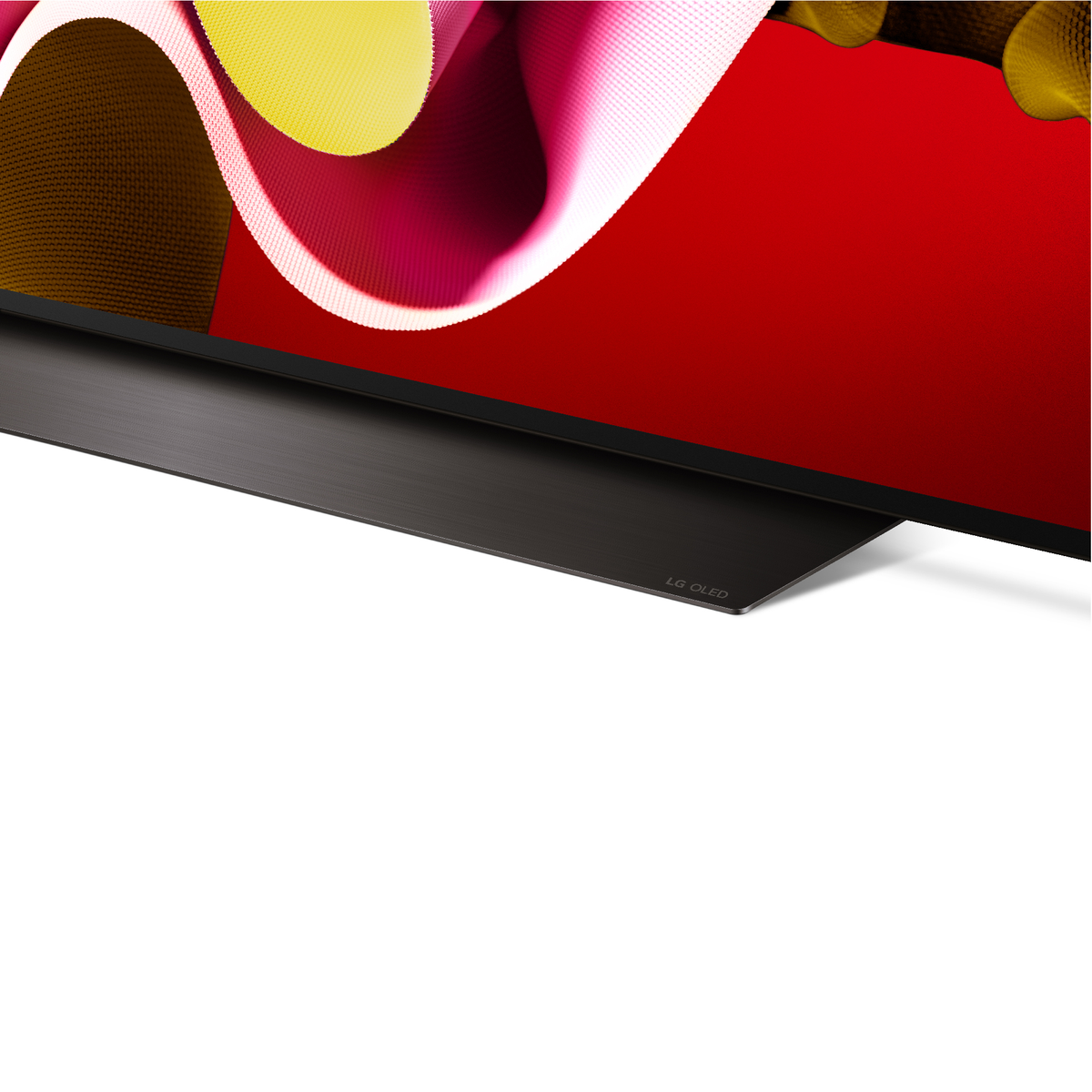 TV LG OLED, soporte negro, con fondo rojo y amarillo.