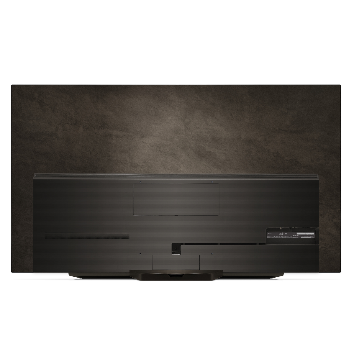 Vista trasera de un televisor negro con un fondo marrón texturizado. El televisor tiene un soporte.