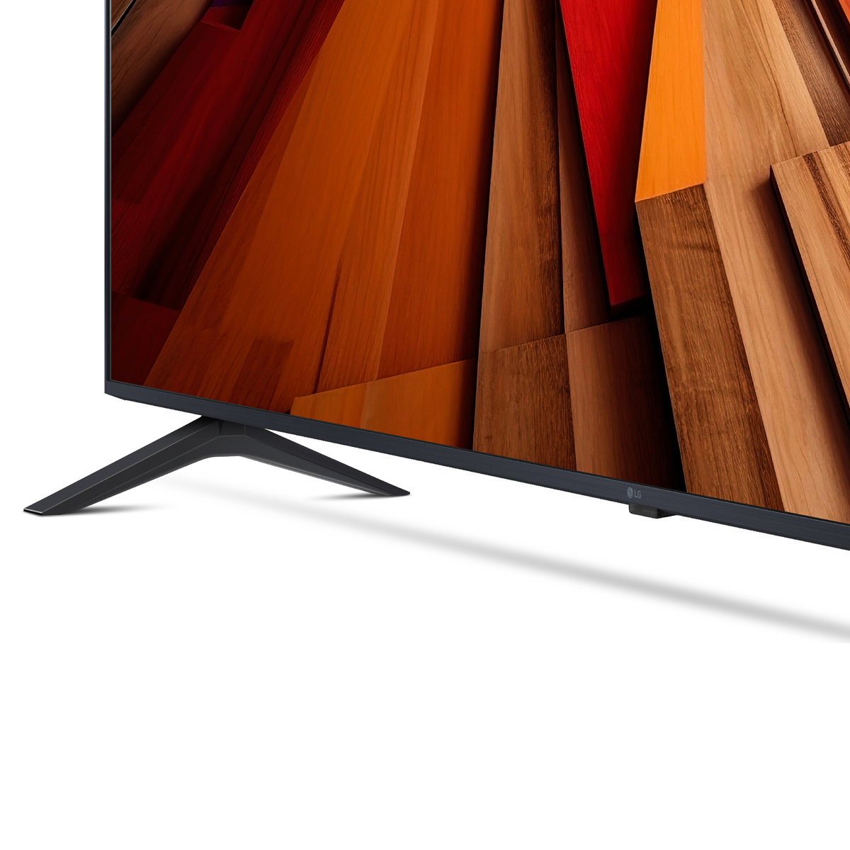 Primer plano de un televisor con soporte, que muestra una pantalla colorida y el logotipo de LG.