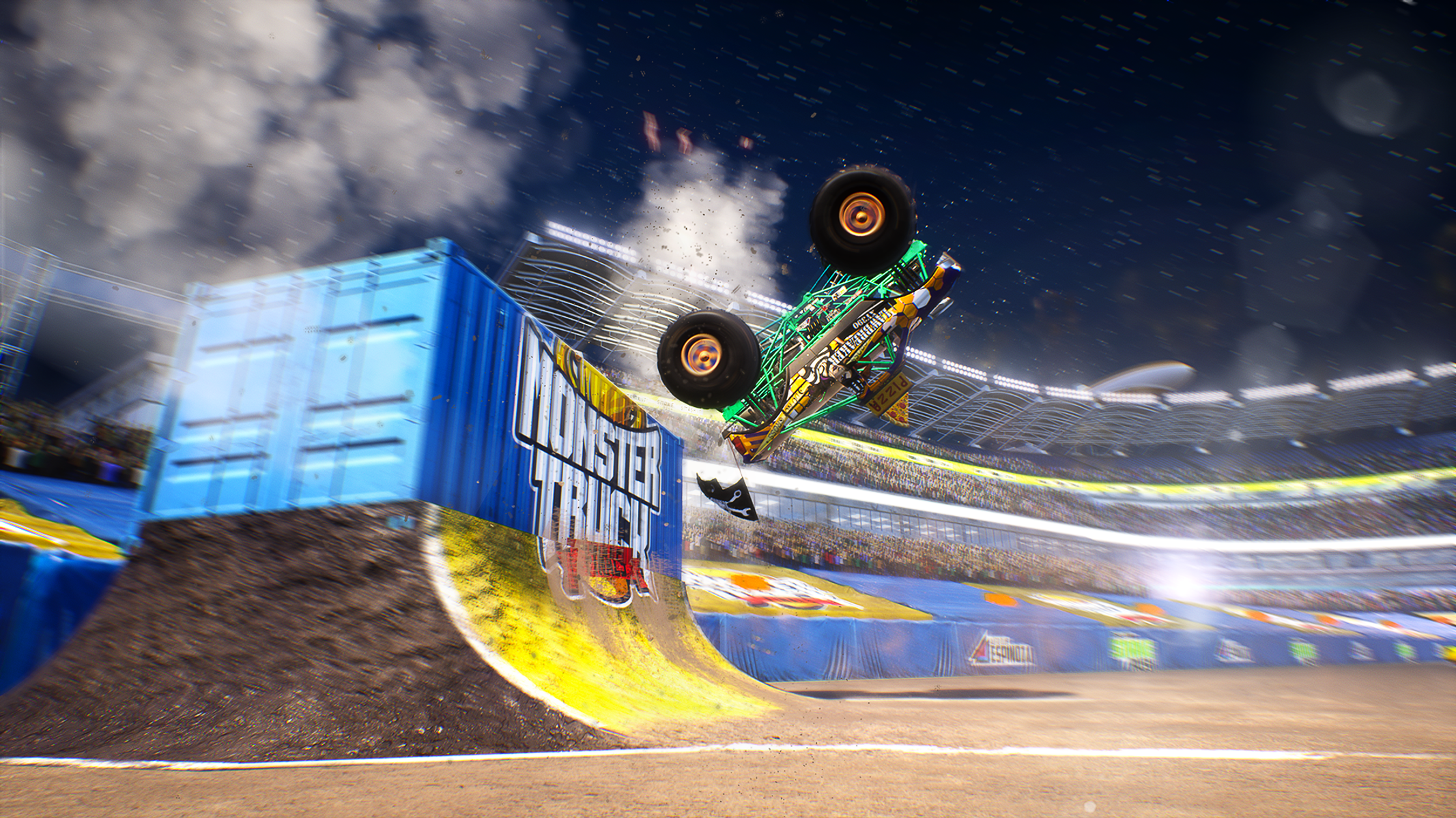 Un monster truck a mezz'aria che fa un'acrobazia sopra una rampa.