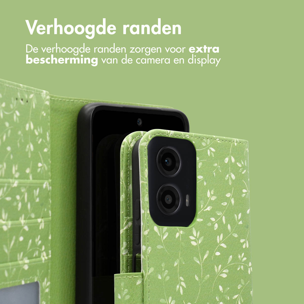 Groen telefoonhoesje met wit bloemmotief. Zwarte telefoon binnenin, groene achtergrond.