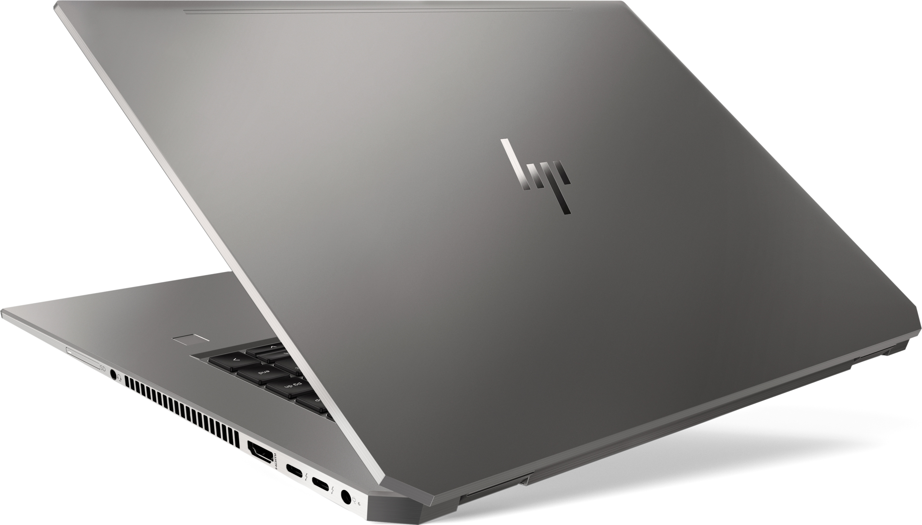 A gray laptop on a white surface, open at an angle. The HP logo is visible on the back.