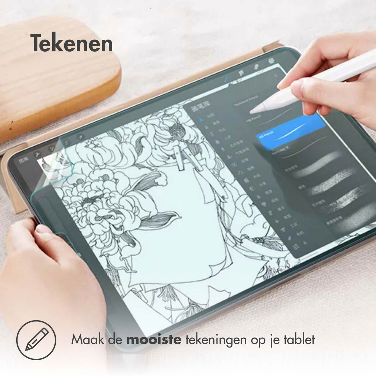 Tablet with screen protector and hand using stylus. Drawing on the screen. Text says 'Drawing'.