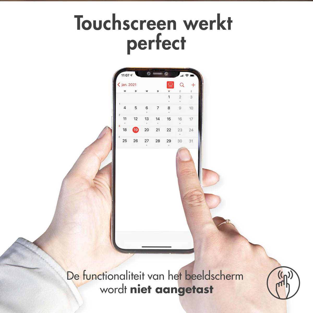 A hand operates a smartphone showing a calendar for January 2021.