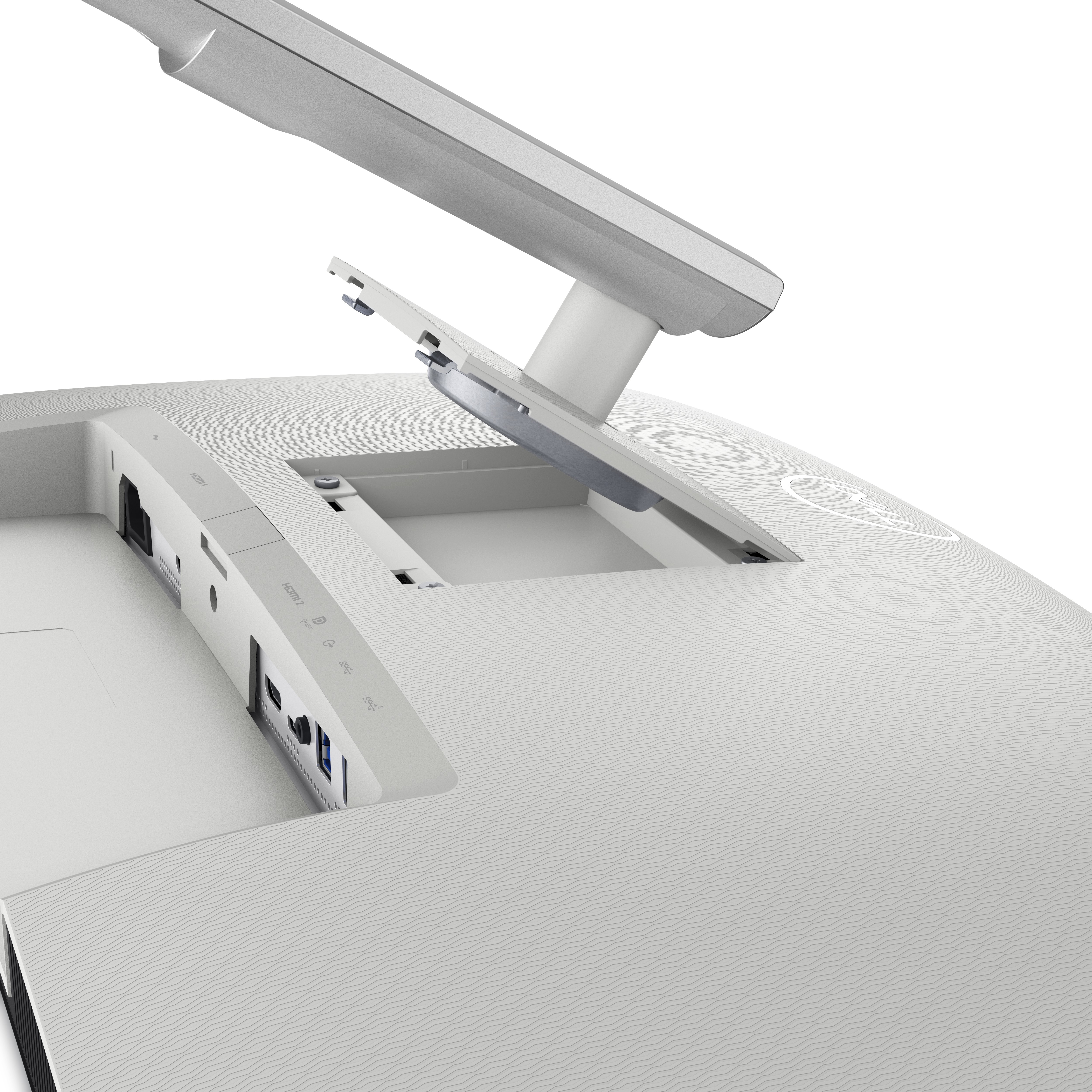 Base de monitor de computadora blanca con puertos de cable.