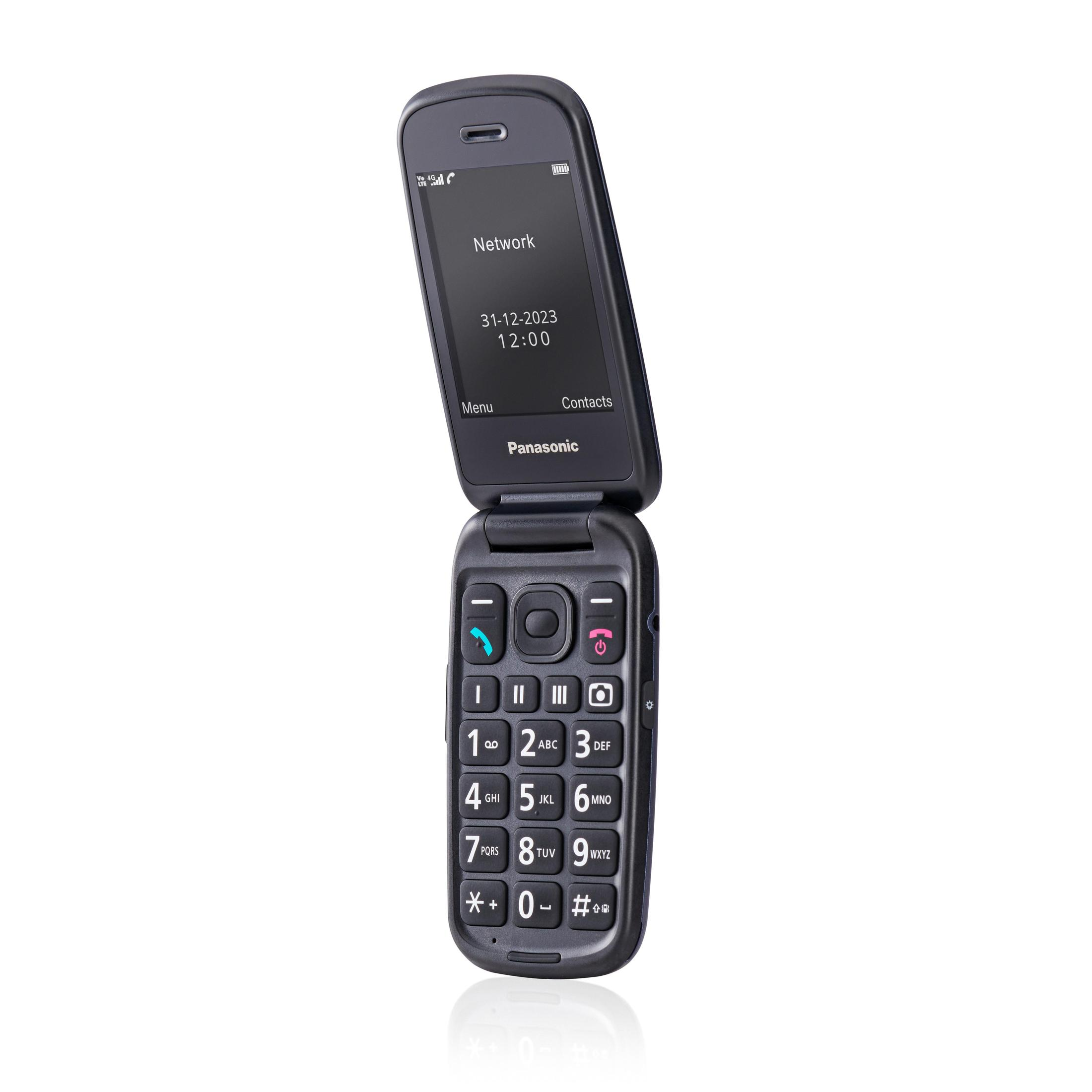 A black Panasonic flip phone is open. The screen displays 'Network', date, time, and 'Contacts'.