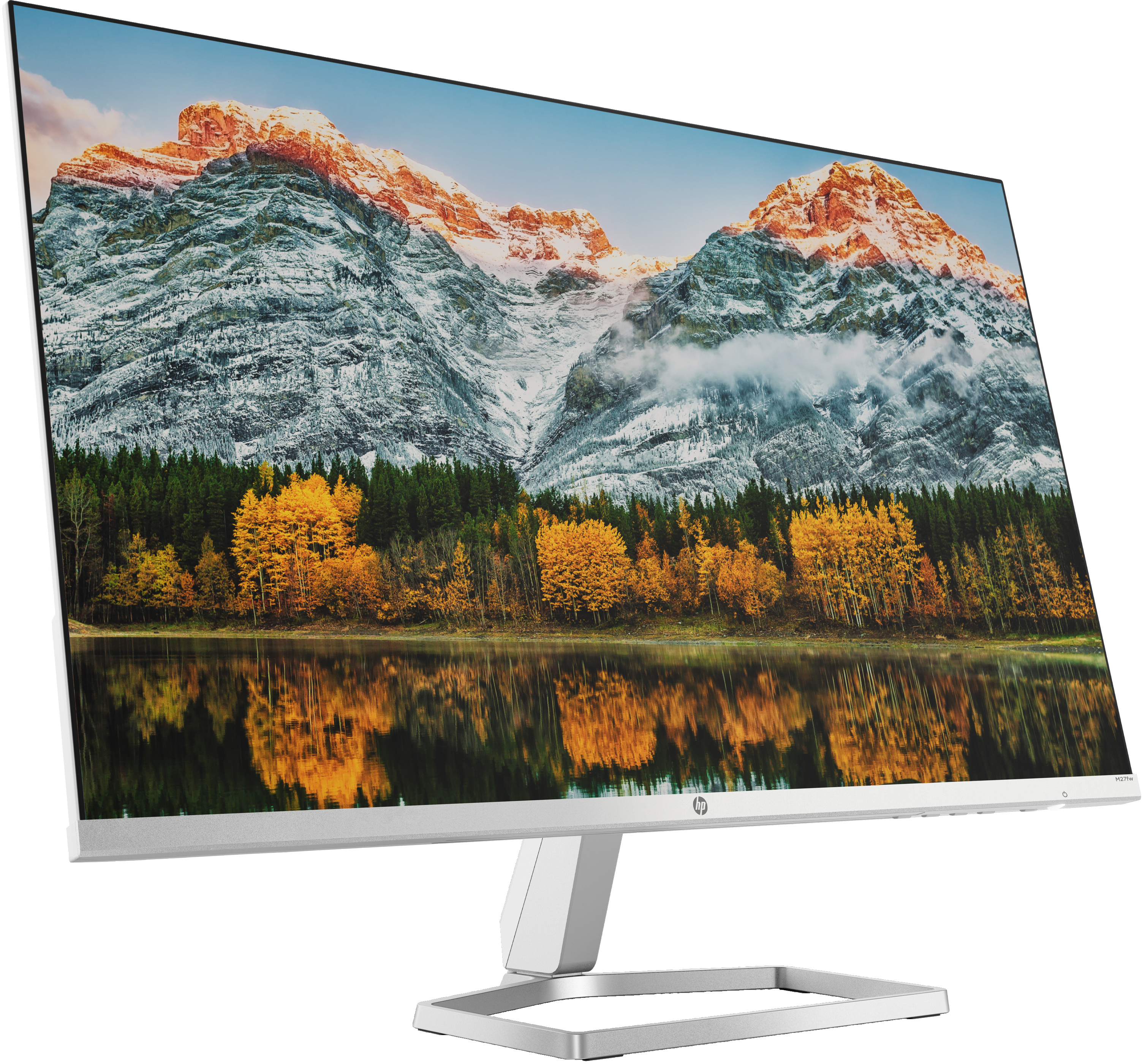 Monitor con immagine di paesaggio di montagne, lago e alberi.