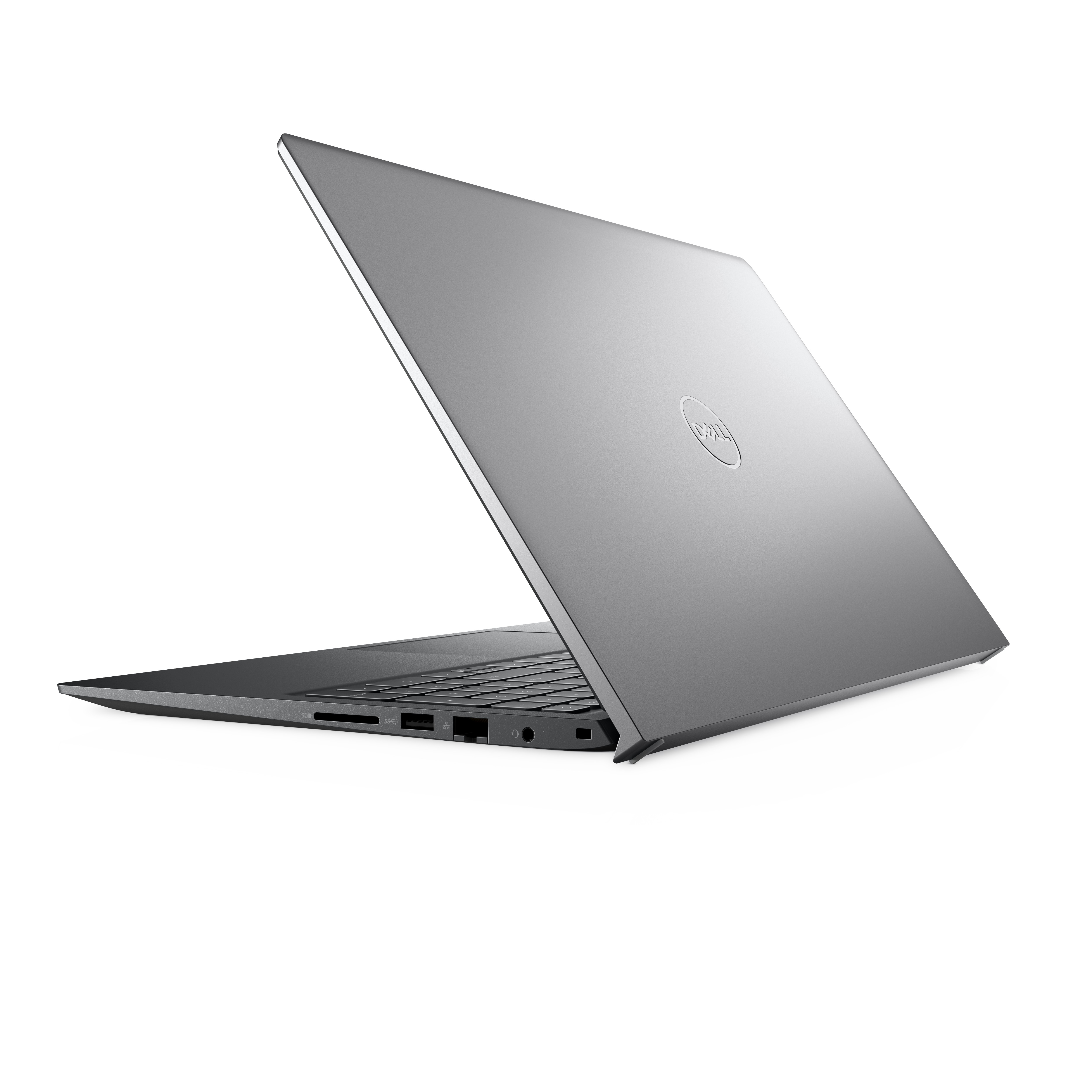 Un laptop argentato aperto su una superficie bianca, angolato, che mostra la tastiera e il logo Dell.