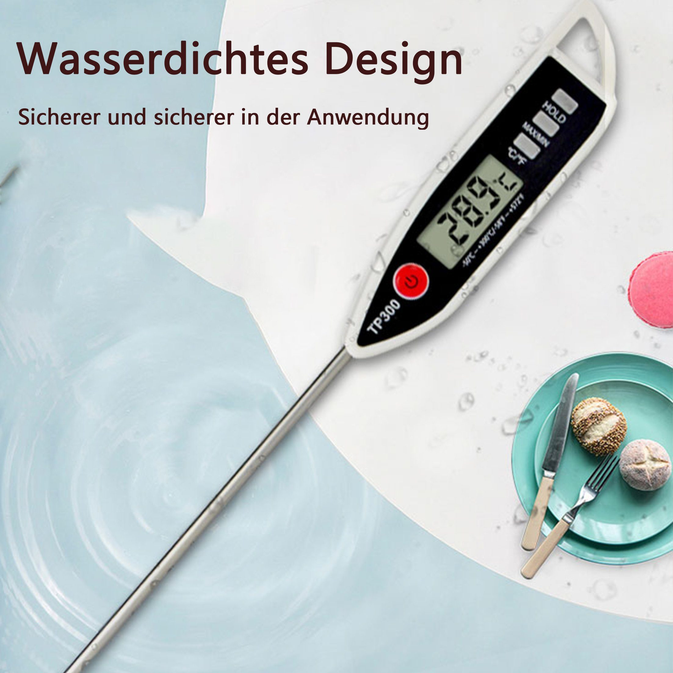 Digitales Lebensmitteltemperatur-Thermometer mit Metallsonde, zeigt Temperatur auf einem Teller und einer Gabel.