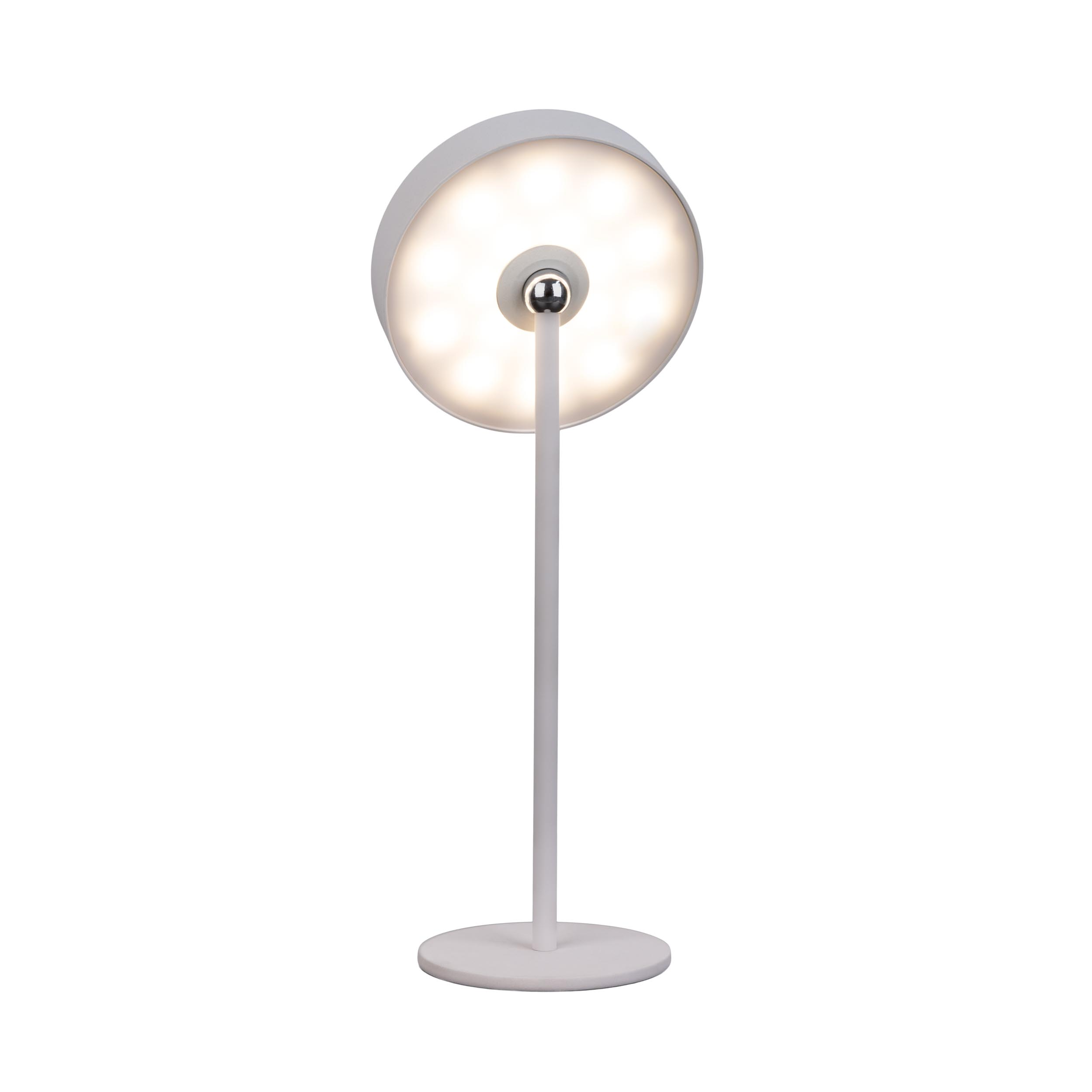 Eine weiße Schreibtischlampe mit kreisförmigem Licht. Sie hat einen Sockel, einen Stiel und das Licht.