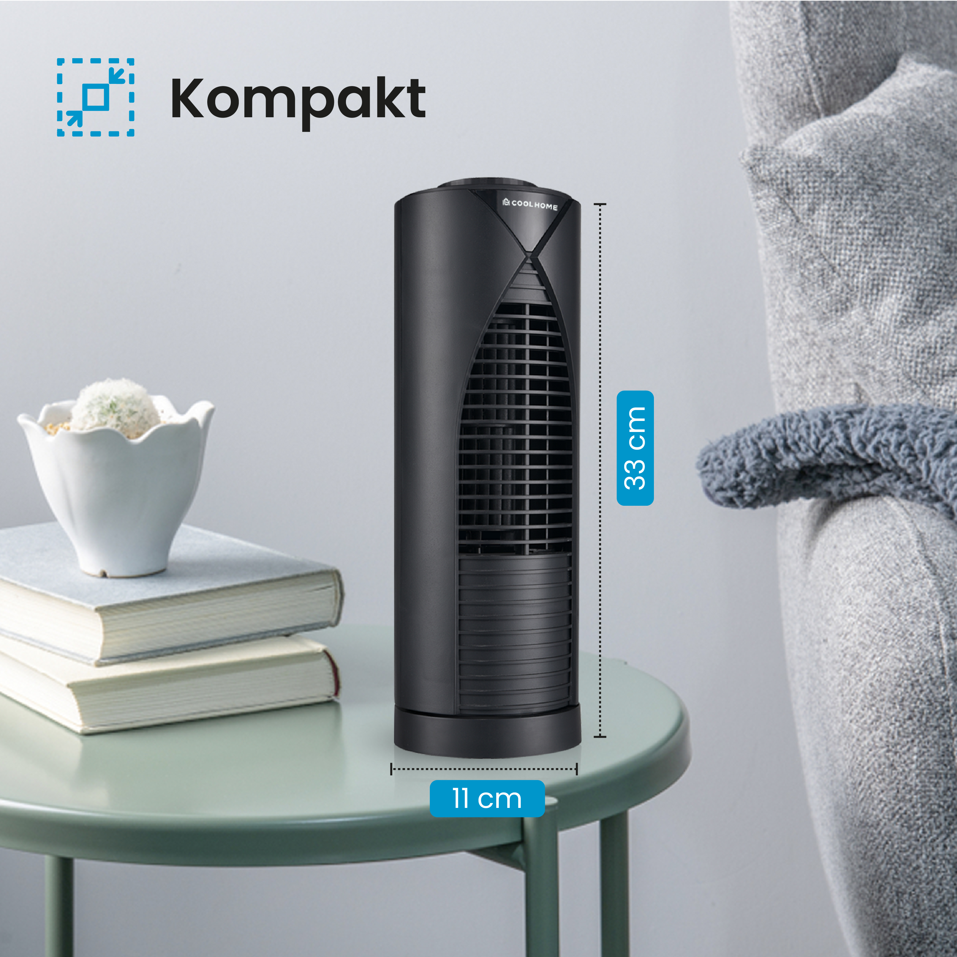 Schwarzer, kompakter Turmventilator auf einem mintgrünen Tisch. Text: Kompakt, und Abmessungen von 33 cm hoch und 11 cm breit.