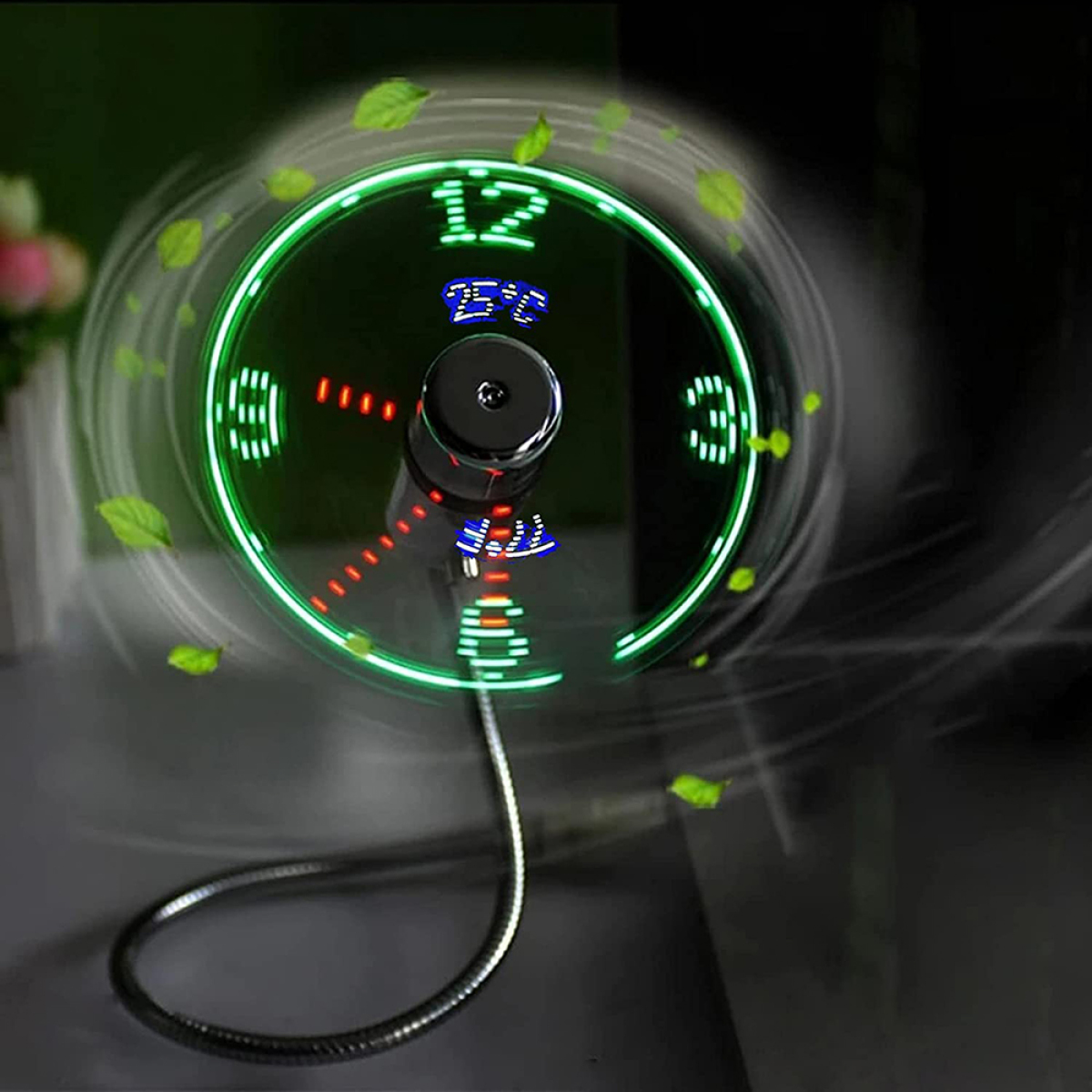 Ein kleiner Ventilator mit grünem Lichtring, einige Blätter schweben darum.