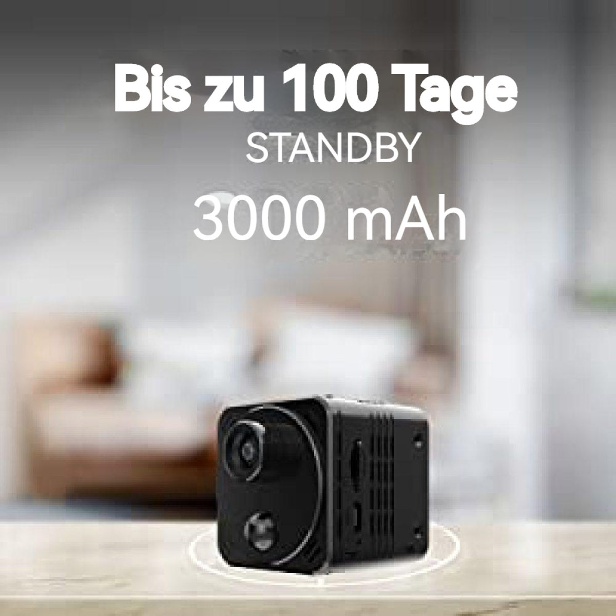 Eine kleine schwarze Kamera mit Text über die Akkulaufzeit. Kamera liegt auf einer Oberfläche mit unscharfem Hintergrund.
