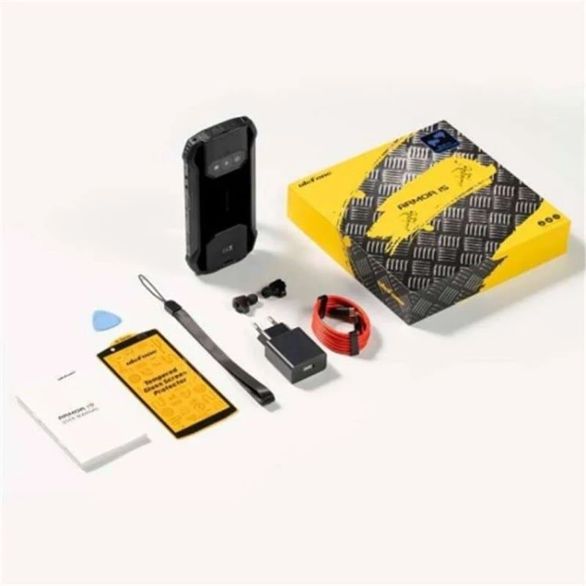 Czarny telefon, pudełko, akcesoria i opakowanie, wszystko na białym tle.