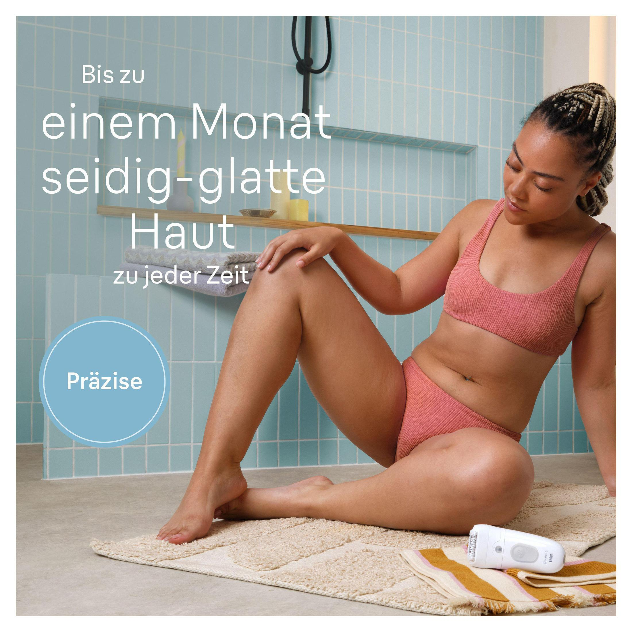 Kobieta w różowej bieliźnie goli nogi w łazience.