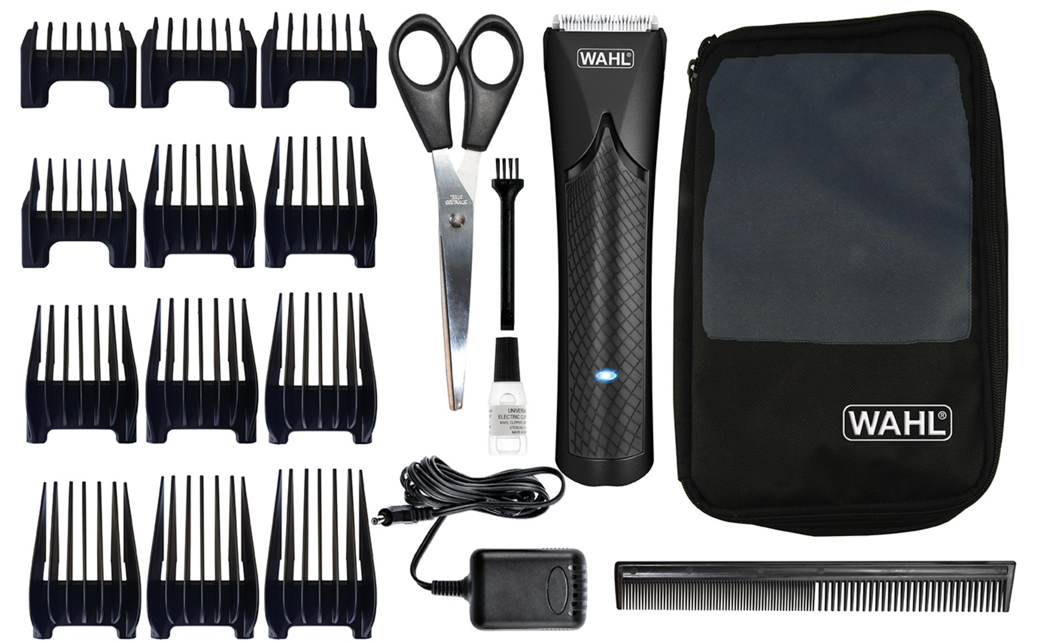 Schwarzes Wahl Haarschneide-Set mit Aufsätzen, Schere, Öl und Ladegerät. Weißer Hintergrund.