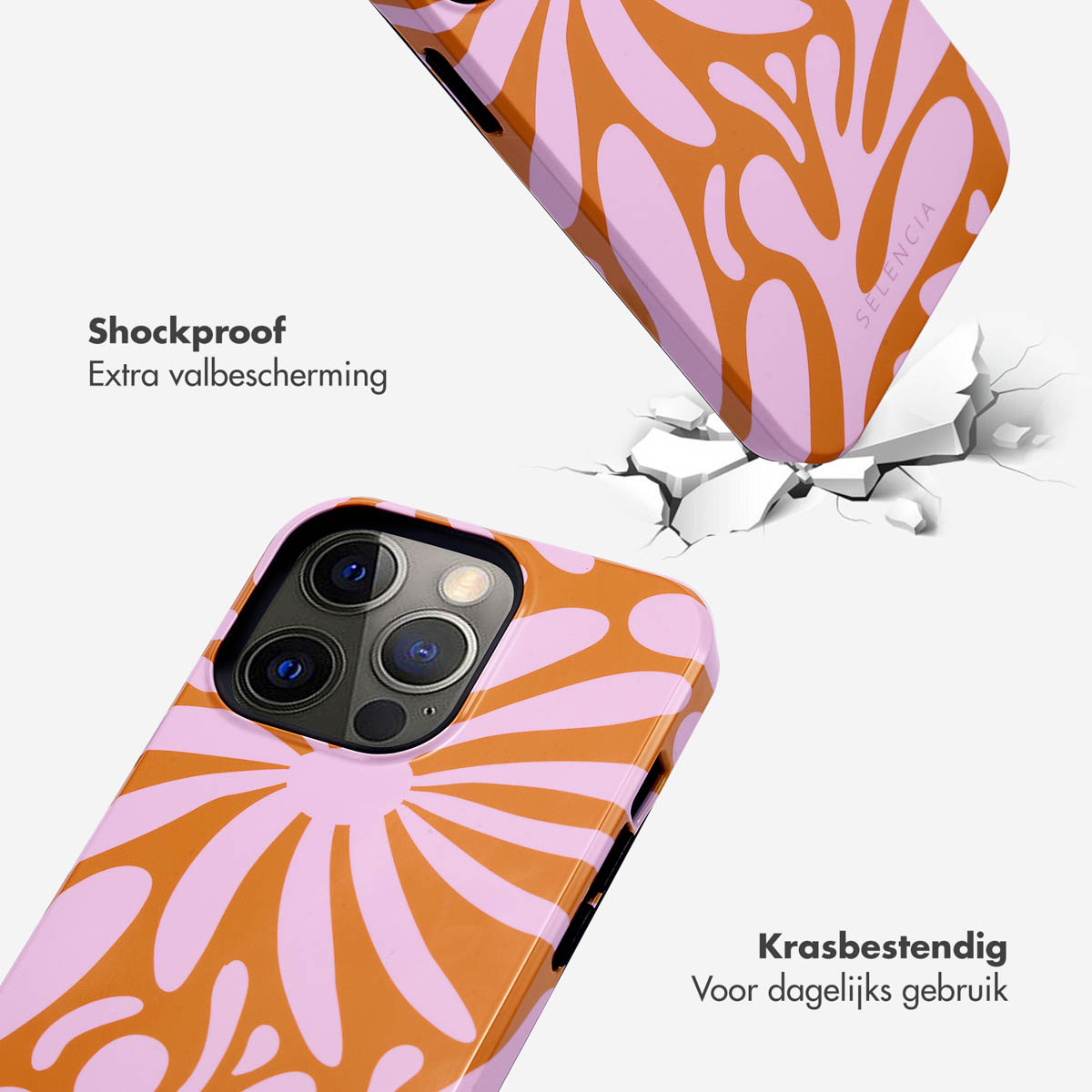 Cover per telefono floreale arancione e rosa chiaro che cade su superficie bianca.