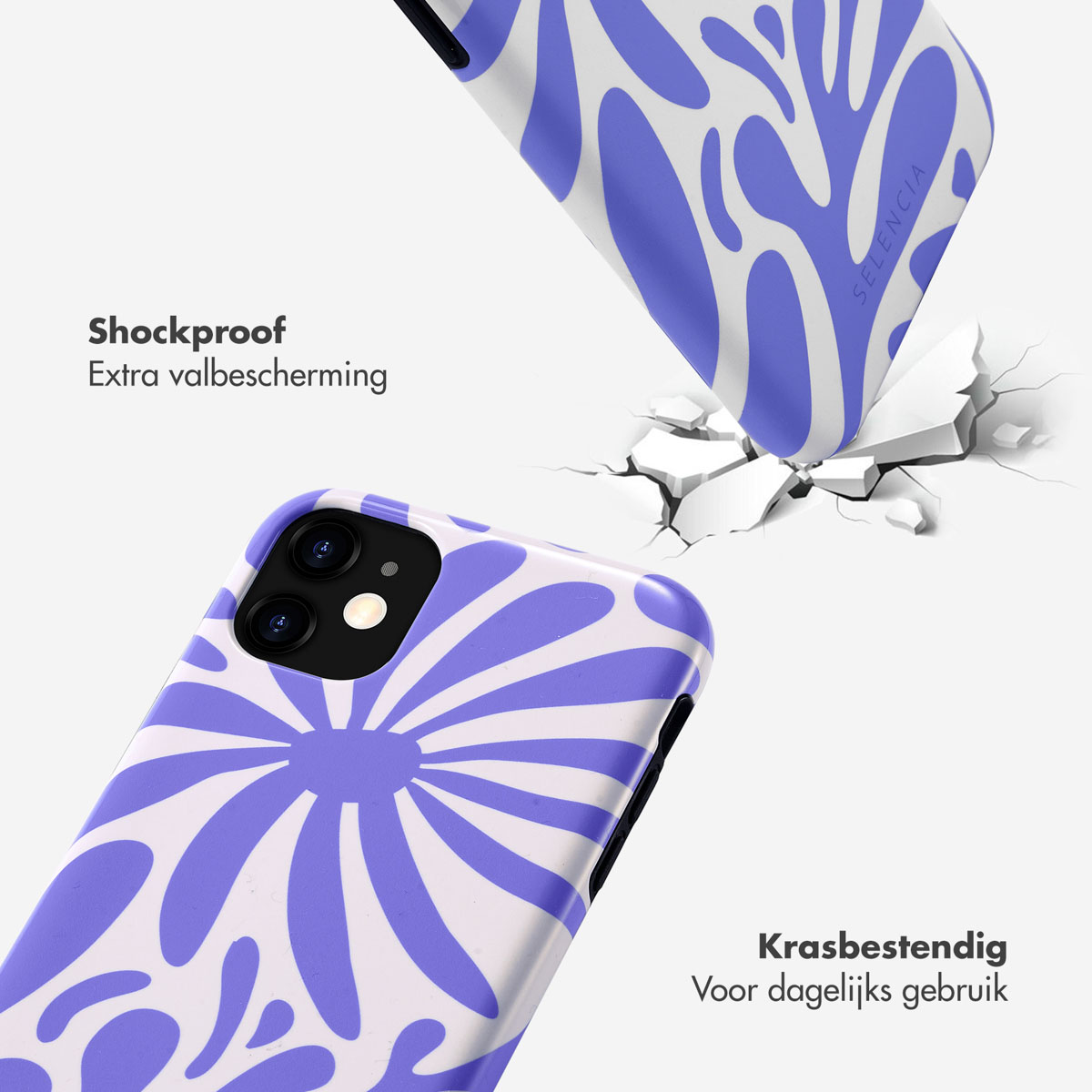 Deux coques de téléphone avec un motif floral bleu et blanc. L'une tombe, l'autre intacte.
