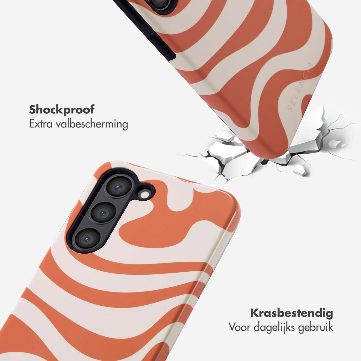 Deux téléphones avec des étuis à motifs ondulés orange et blanc. L'un tombe et montre l'impact. Fond blanc.