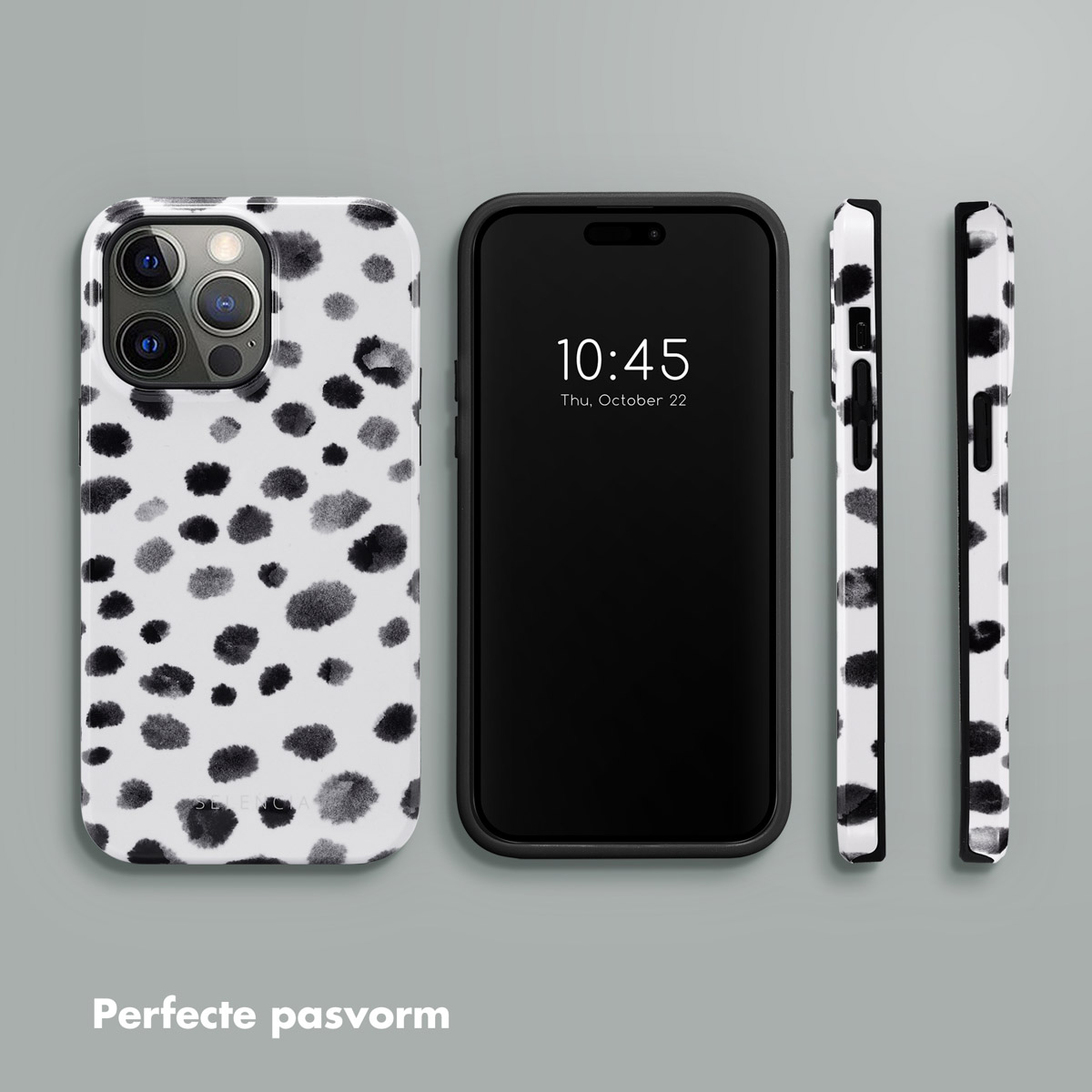 Telefoon met zwart-wit gestippelde hoes. Zwarte telefoon die de tijd toont. Extra gestippelde hoesjes.