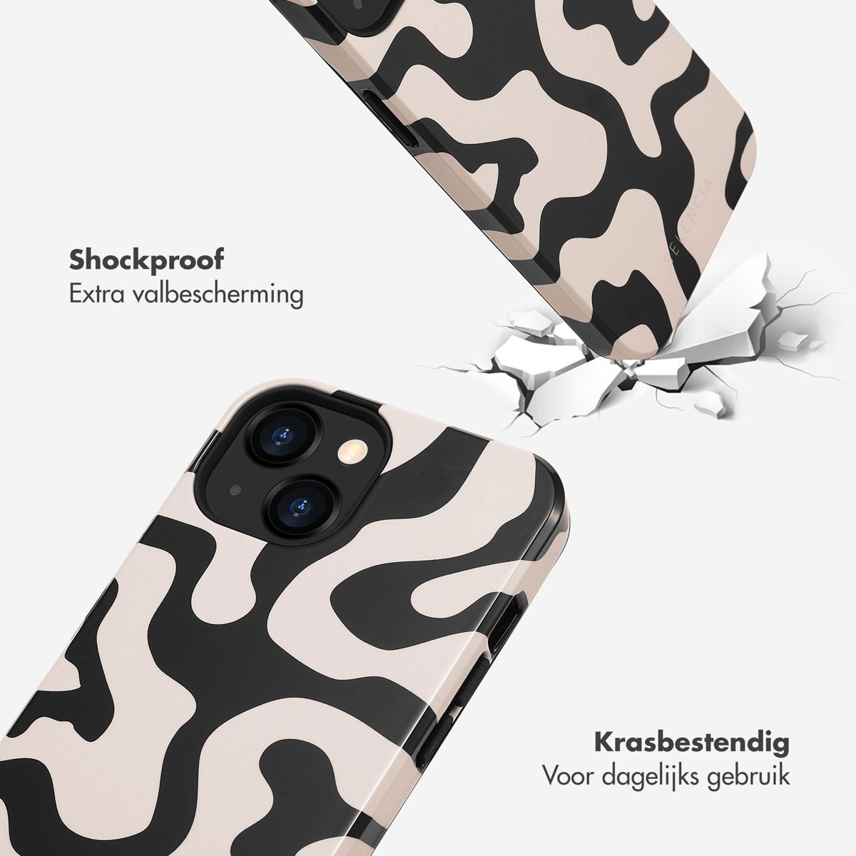 Twee telefoonhoesjes met abstract patroon vallen op gebarsten grond.