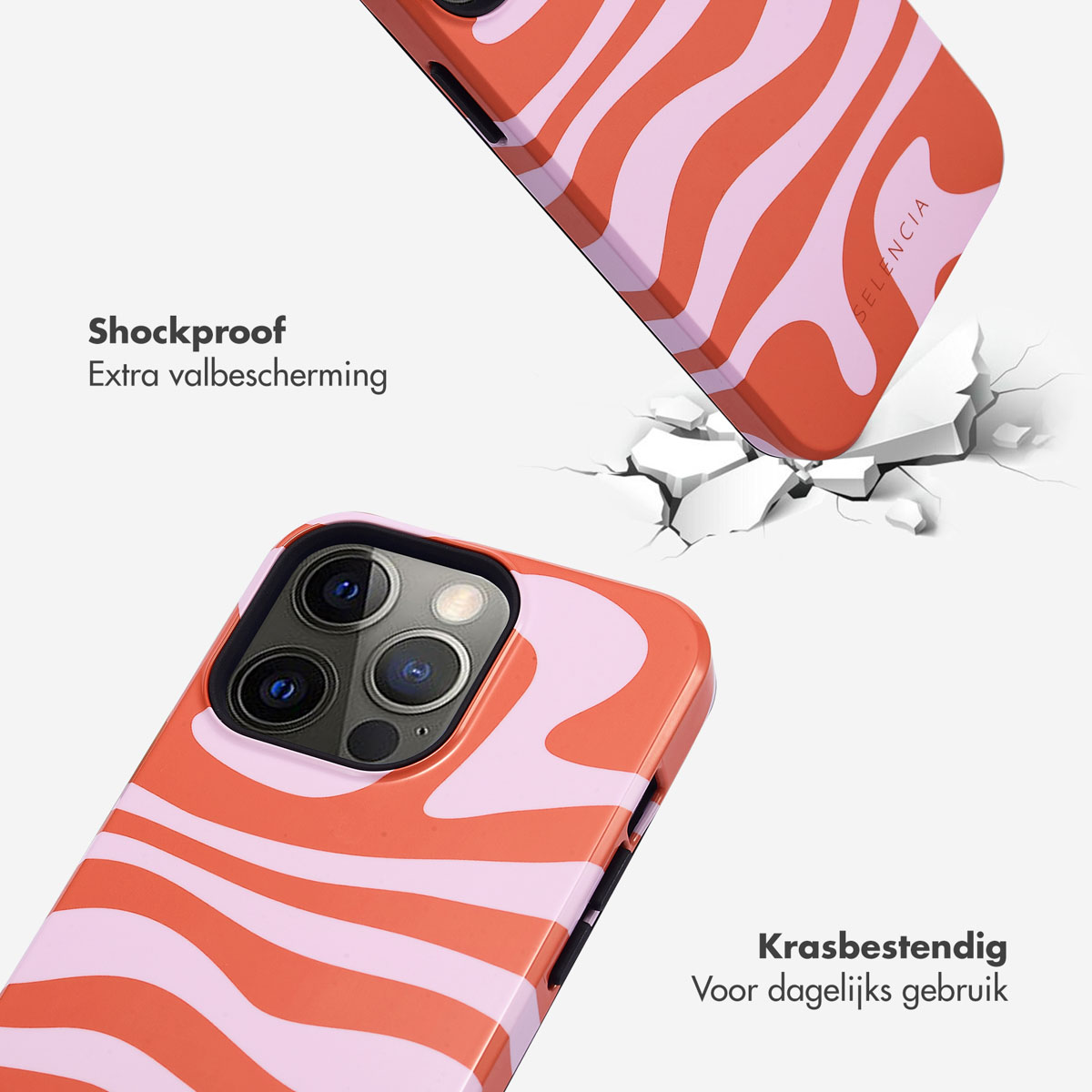 Une coque de téléphone à motifs ondulés roses et oranges traverse un sol blanc.