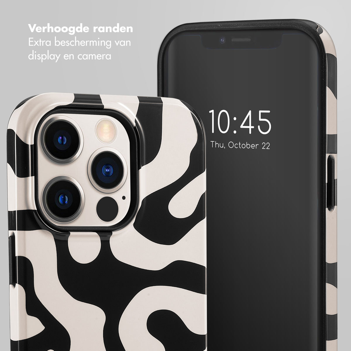 Un téléphone avec une coque à motif noir et blanc à côté d'un écran de téléphone.