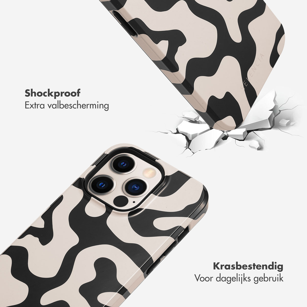 Une coque de téléphone à motif noir et blanc traverse une surface blanche.