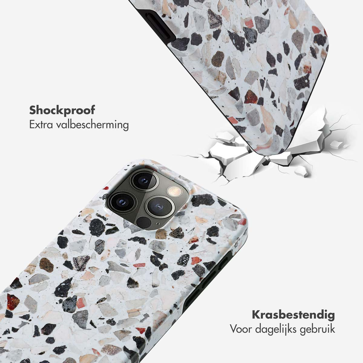 Twee telefoonhoesjes met terrazzo-patroon, één valt en breekt de grond.